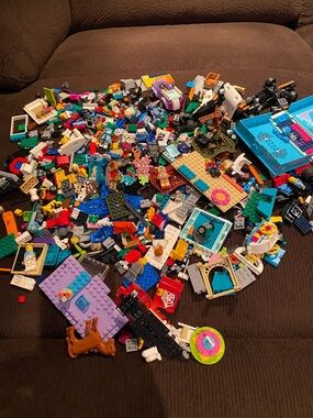 Lego box with tons of mini Figures and roughly 4 pounds (C)